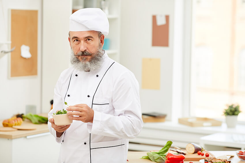 professional-chef-posing-in-kitchen-73YN8D2.jpg